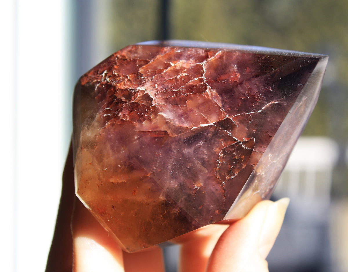 Red Dreamcoat Lemurian seed quartz tower with Super 7 inclusions and a Lemurian quartz core.