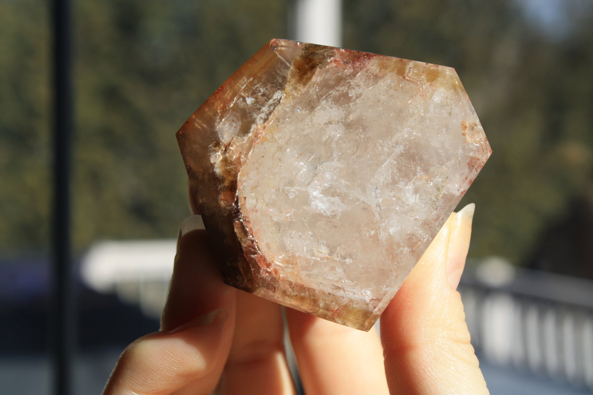 Red Dreamcoat Lemurian seed quartz tower with Super 7 inclusions and a Lemurian quartz core bottom view
