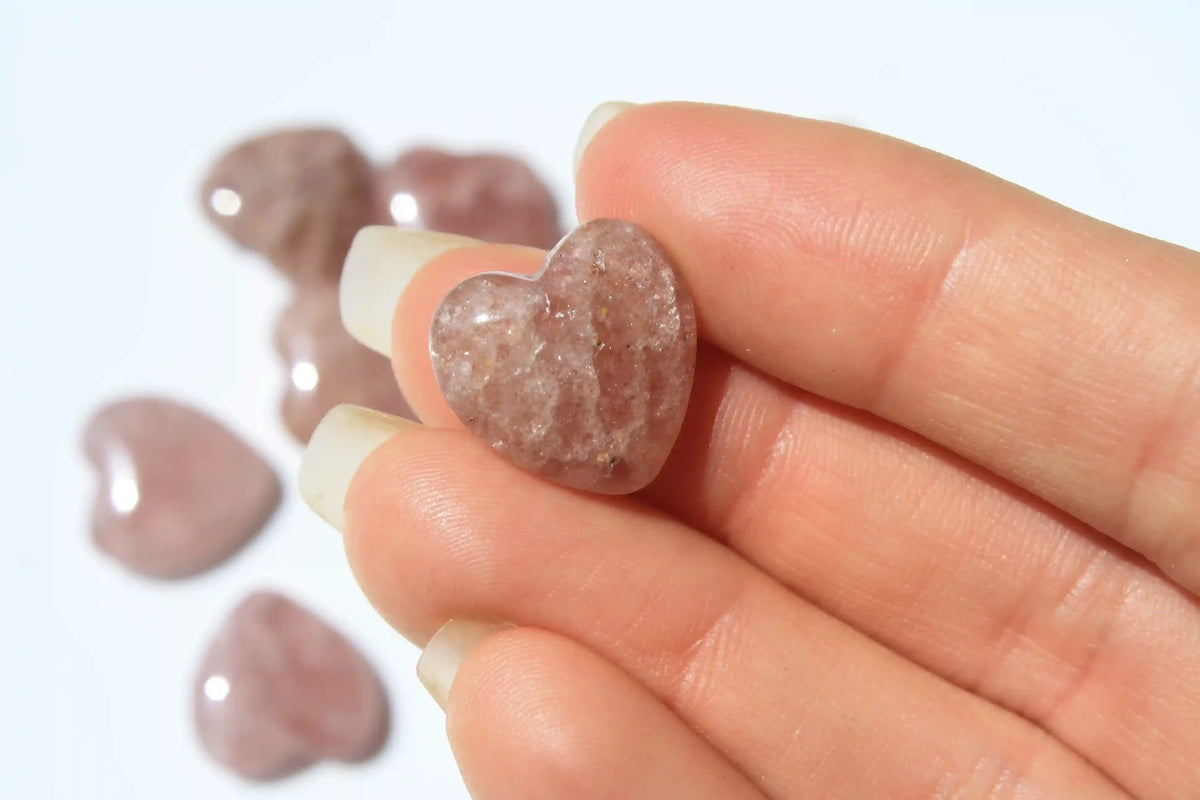 Strawberry quartz heart-shaped crystal with soft pink-red tones symbolizing love, joy, and emotional uplift. quartz heart, Canadian crystal shop