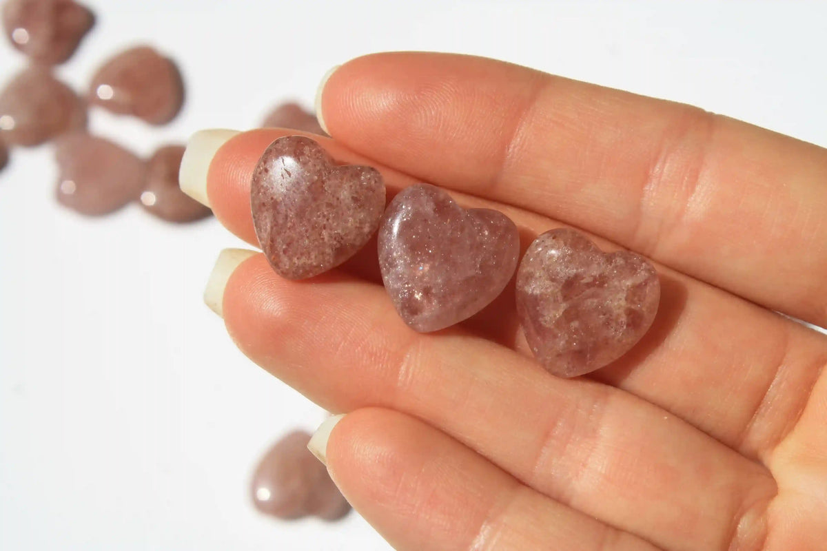 Strawberry quartz heart-shaped crystal with soft pink-red tones symbolizing love, joy, and emotional uplift. quartz heart, Canadian crystal shop