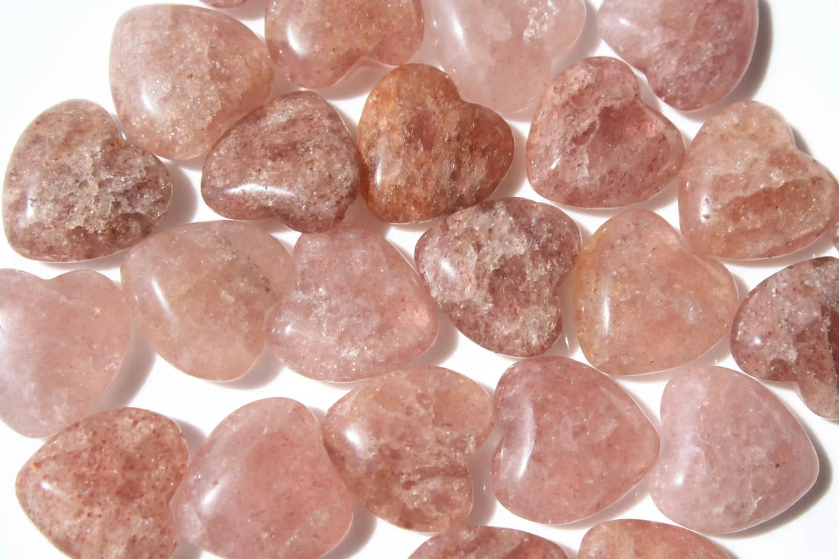 Strawberry quartz heart-shaped crystal with soft pink-red tones symbolizing love, joy, and emotional uplift. quartz heart, Canadian crystal shop