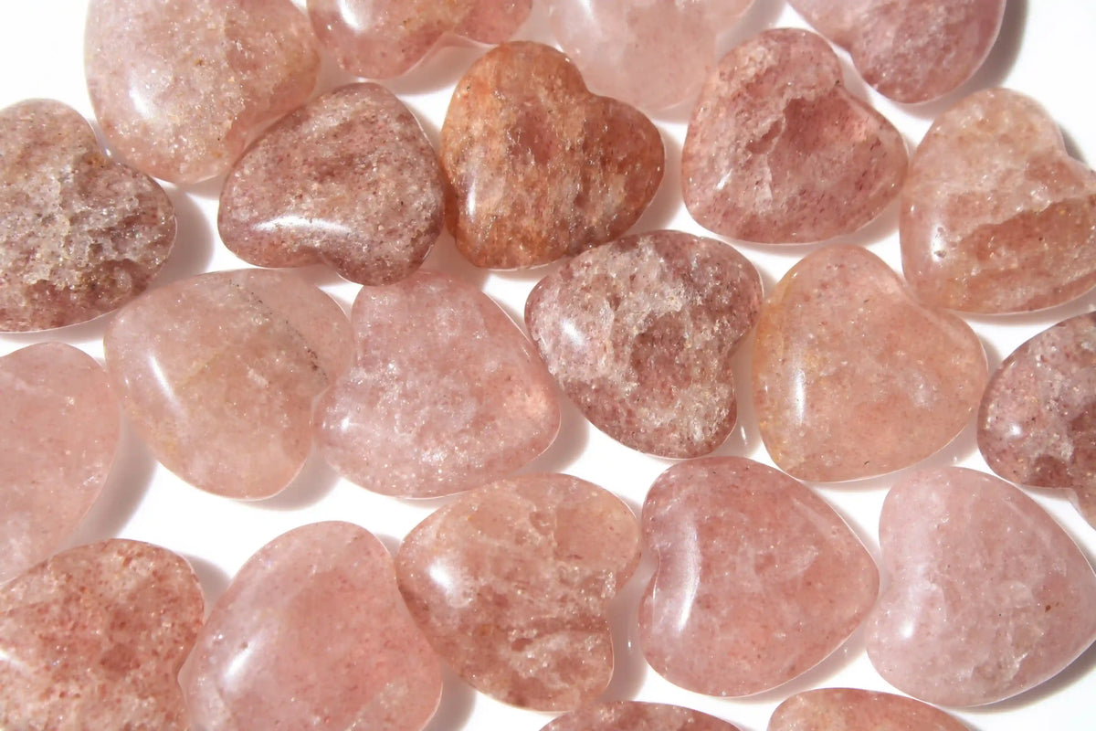Strawberry quartz heart-shaped crystal with soft pink-red tones symbolizing love, joy, and emotional uplift. quartz heart, Canadian crystal shop