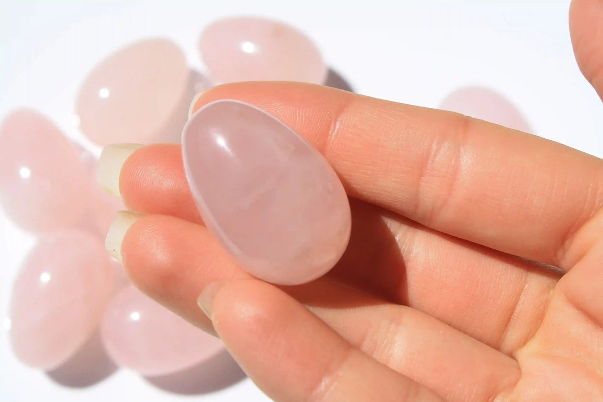 Rose quartz egg-shaped crystal symbolizing love, compassion, rose quartz, quartz crystal, Canadian crystal shop