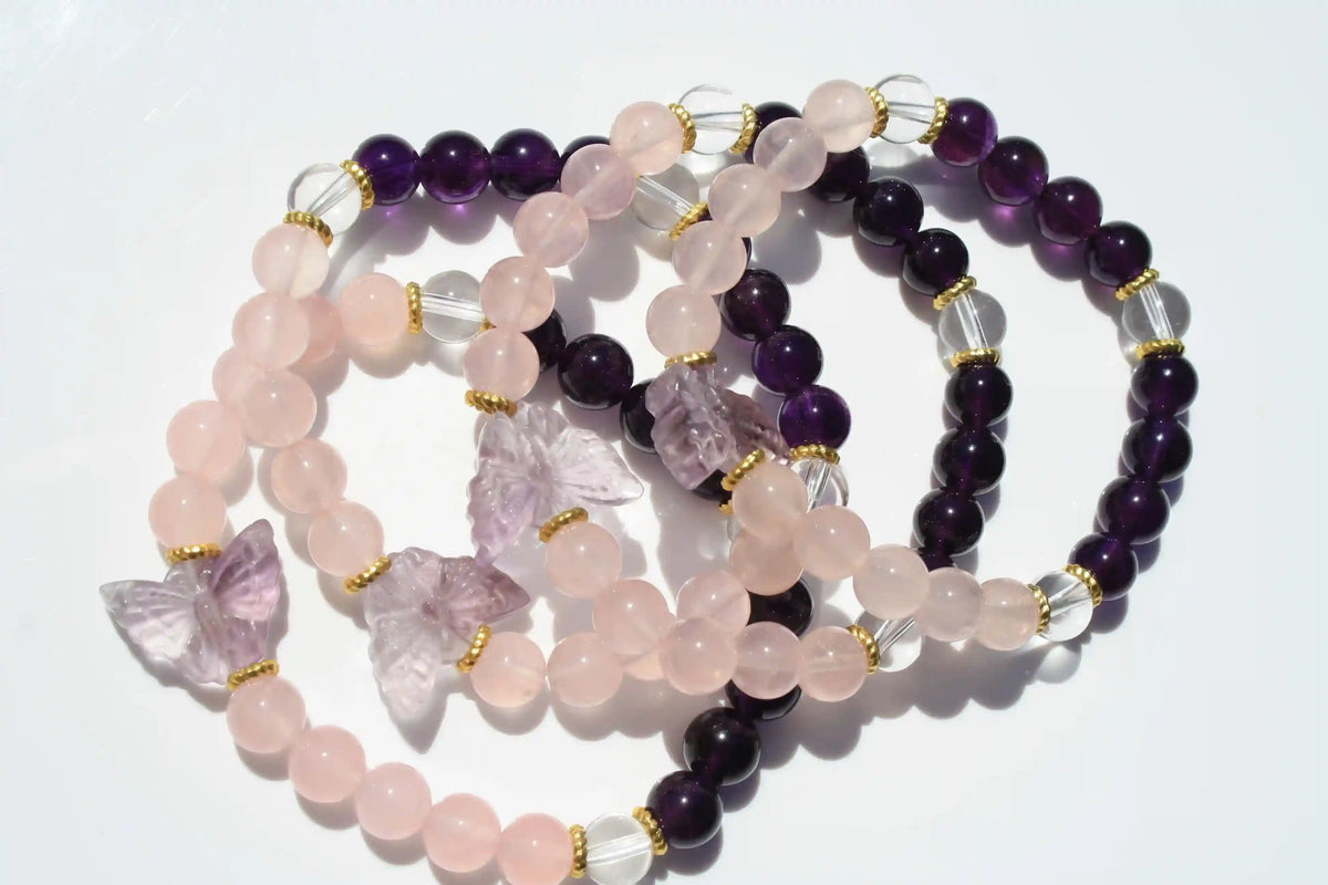 Beaded crystal bracelet with rose quartz and amethyst crystal and butterfly charms