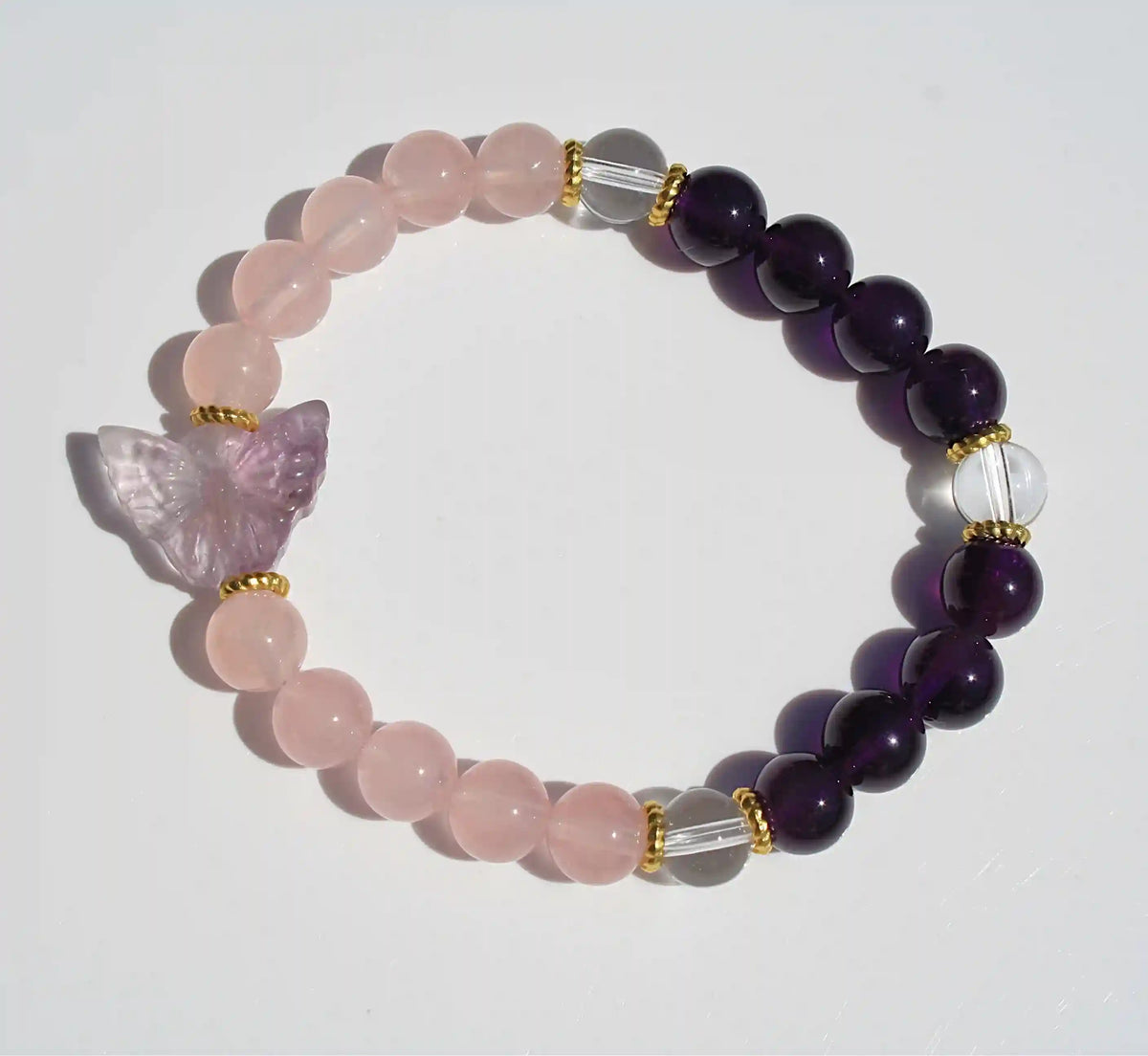 Beaded crystal bracelet with rose quartz and amethyst crystal and butterfly charms
