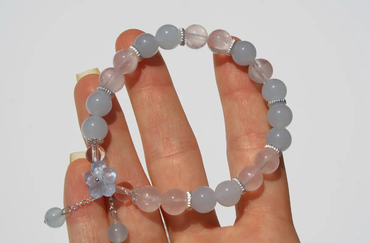 clear and rose quartz crystal bracelet with flower design