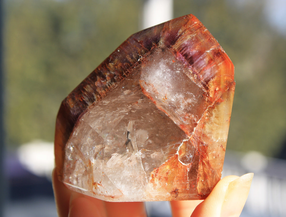 Red Dreamcoat Lemurian seed quartz tower with Super 7 inclusions and a Lemurian quartz core.