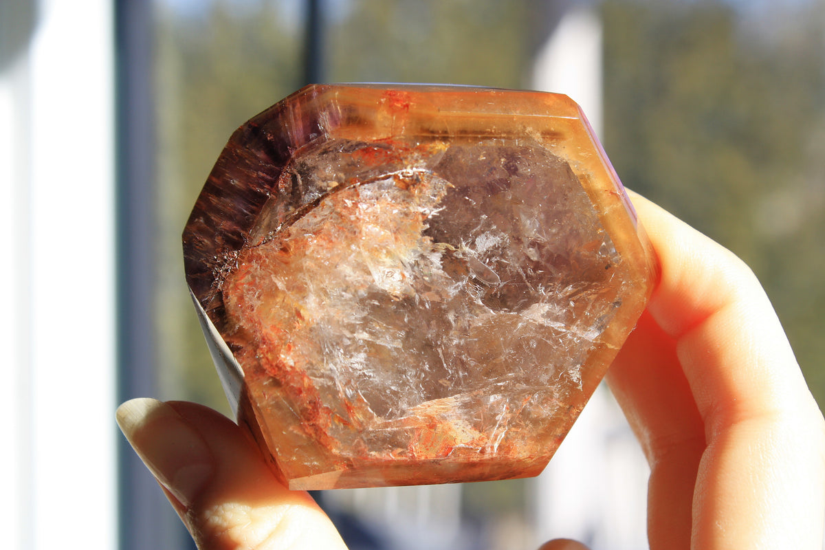 Red Dreamcoat Lemurian seed quartz tower with Super 7 inclusions and a Lemurian quartz core.