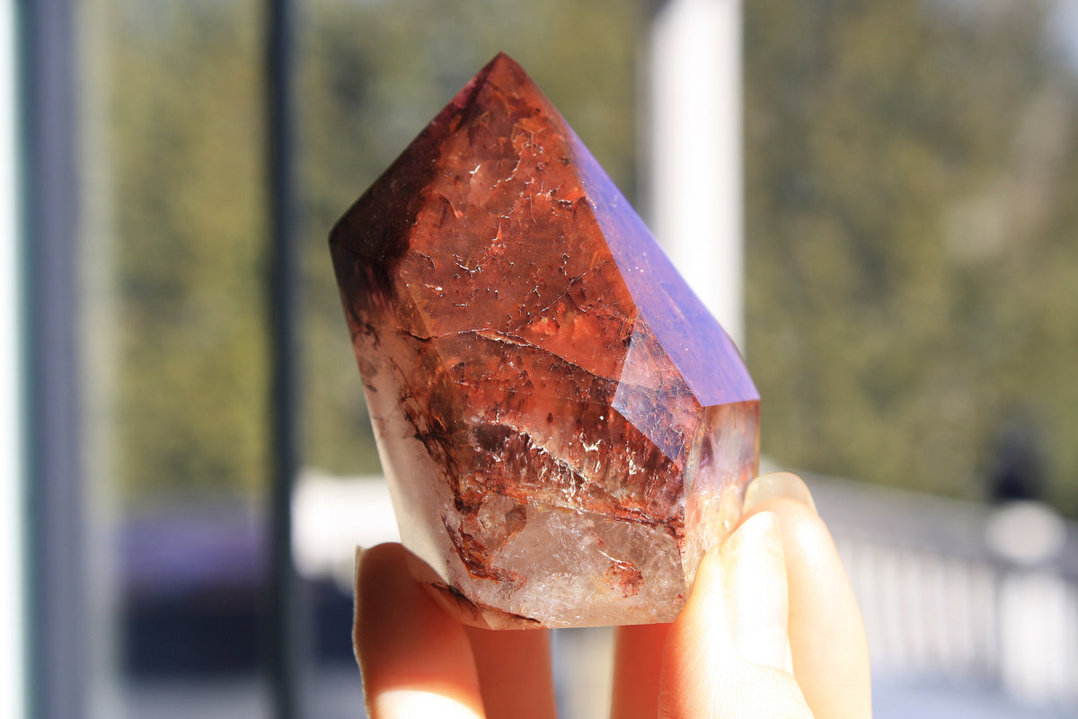 Red Dreamcoat Lemurian seed quartz tower with Super 7 inclusions and a Lemurian quartz core.