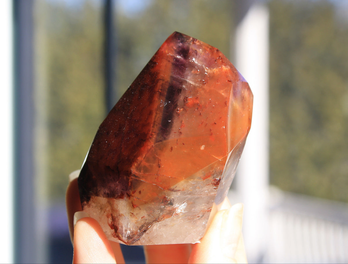 Red Dreamcoat Lemurian seed quartz tower with Super 7 inclusions and a Lemurian quartz core.