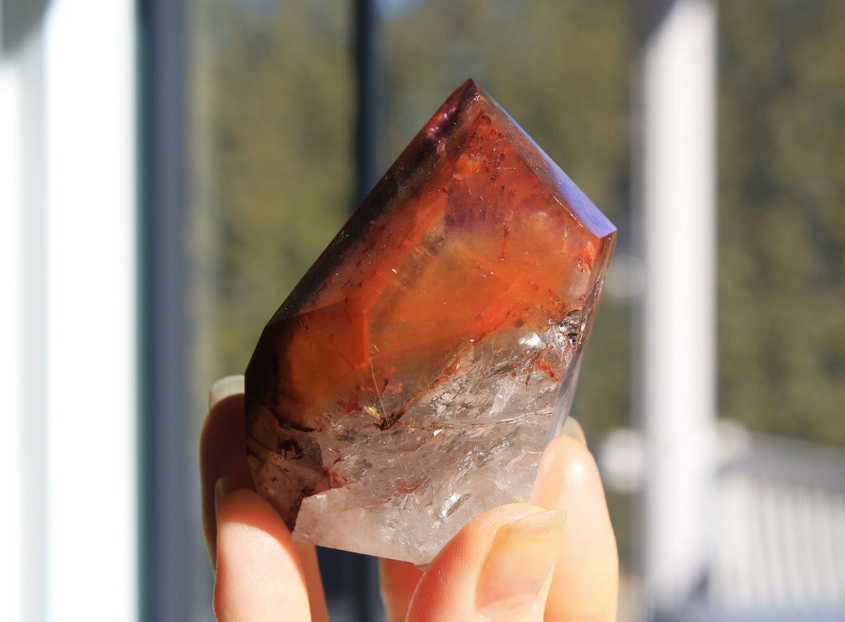 Red Dreamcoat Lemurian seed quartz tower with Super 7 inclusions and a Lemurian quartz core.