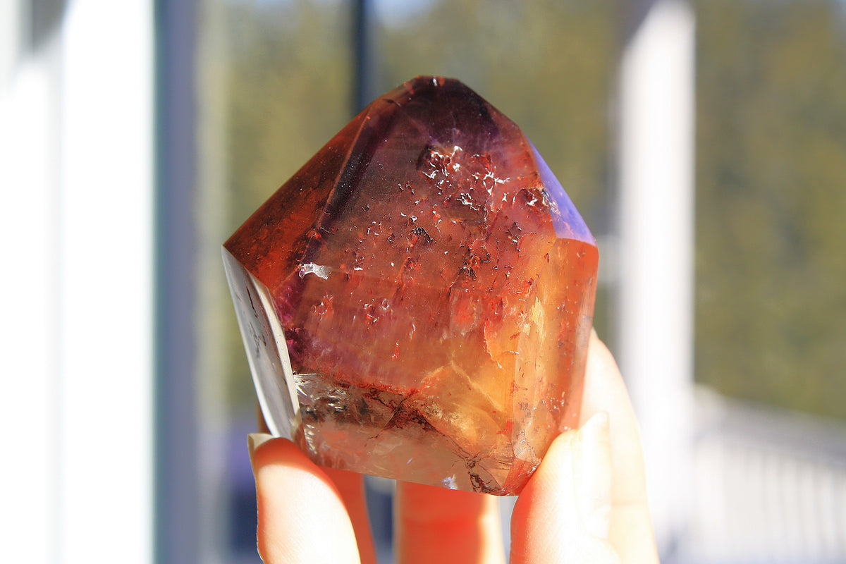 Red Dreamcoat Lemurian seed quartz tower with Super 7 inclusions and a Lemurian quartz core.