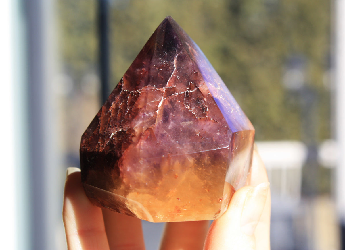Red Dreamcoat Lemurian seed quartz tower with Super 7 inclusions and a Lemurian quartz core side view