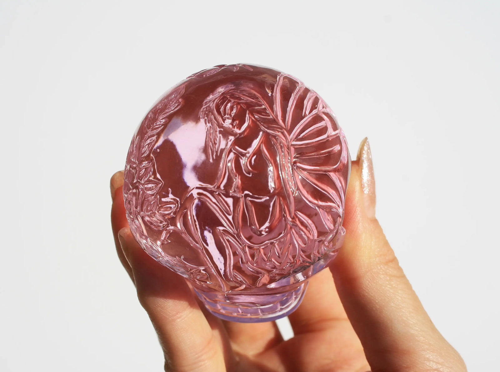 pink obsidian crystal engraved fairy skull 