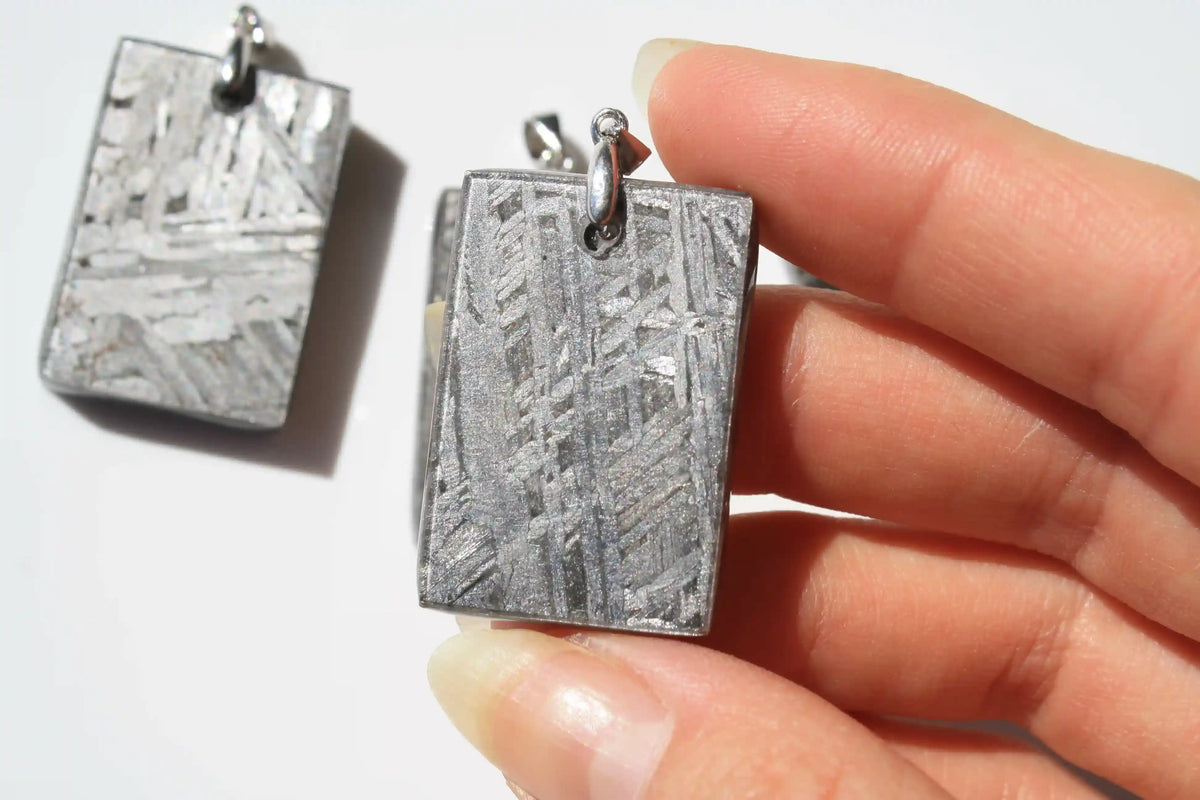 Aletai Meteorite pendants, aletai meteorite, crystal shop, meteorite on stand, crystals from space, moldavite, Widmanstätten Pattern, iron meteorite 