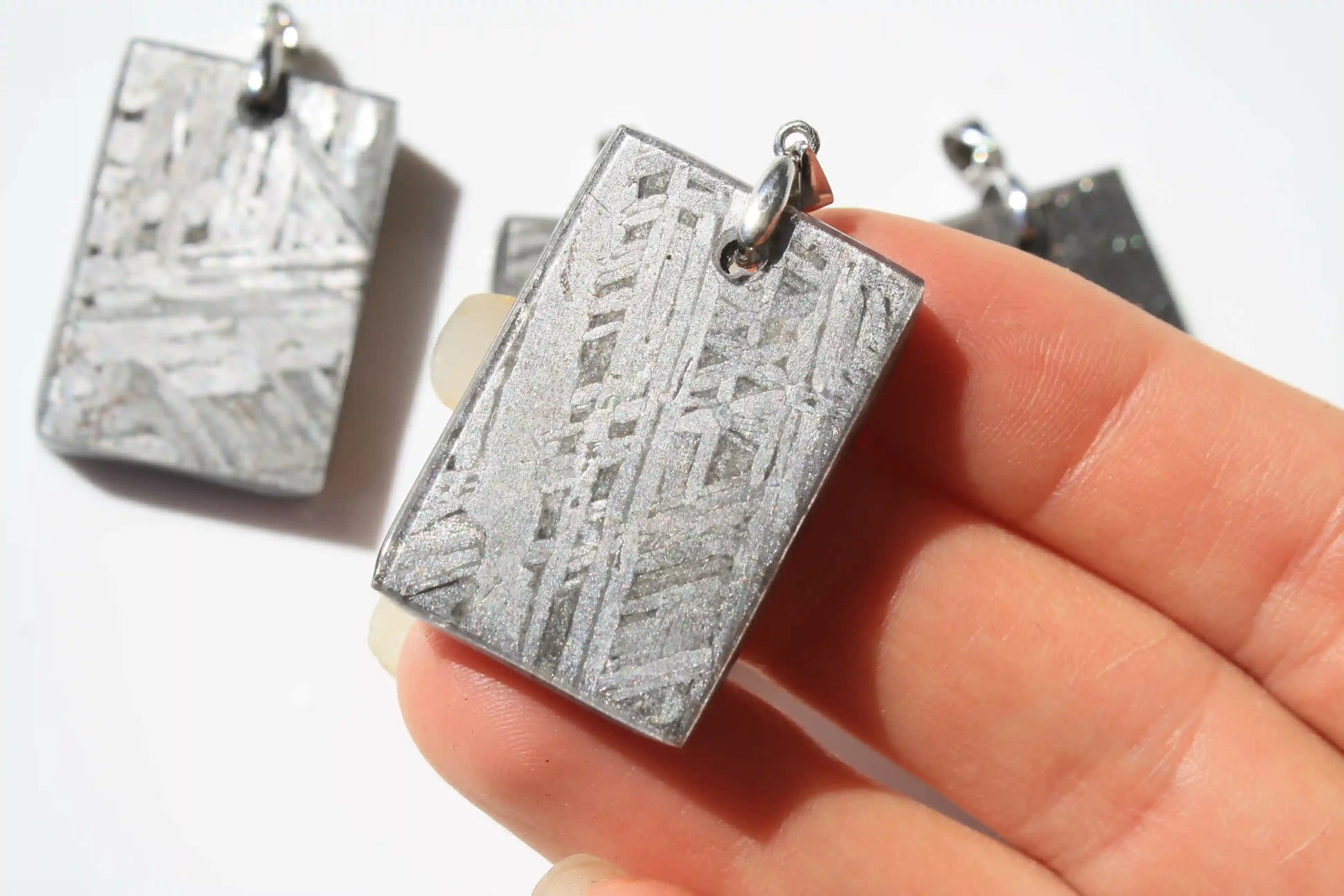 Aletai Meteorite pendants, aletai meteorite, crystal shop, meteorite on stand, crystals from space, moldavite, Widmanstätten Pattern, iron meteorite 