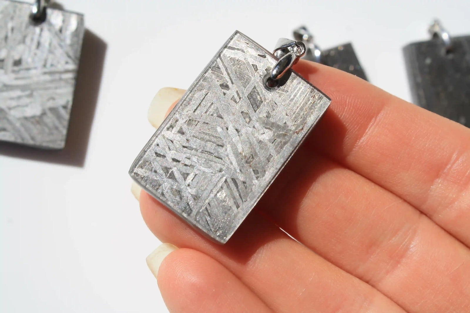 Aletai Meteorite pendants, aletai meteorite, crystal shop, meteorite on stand, crystals from space, moldavite, Widmanstätten Pattern, iron meteorite 
