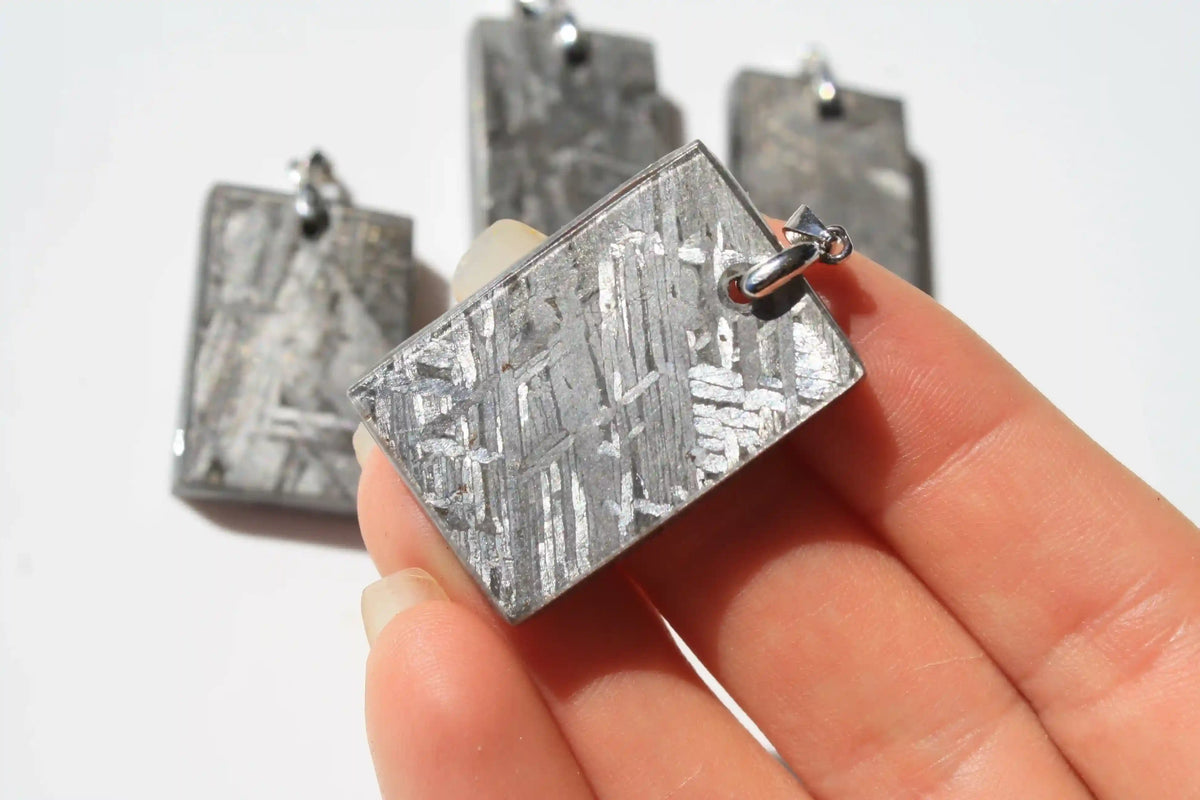 Aletai Meteorite pendants, aletai meteorite, crystal shop, meteorite on stand, crystals from space, moldavite, Widmanstätten Pattern, iron meteorite 
