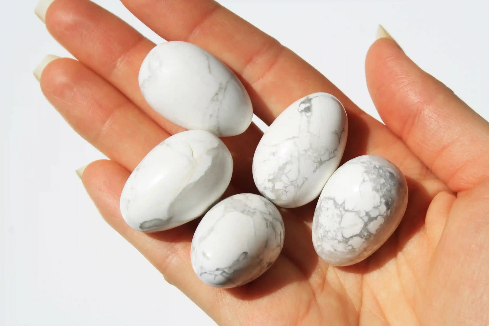 Howlite crystal egg-shaped stone with calming white tones and grey veining, symbolizing peace, clarity, and stress relief, howlite crystal, canadian crystal shop