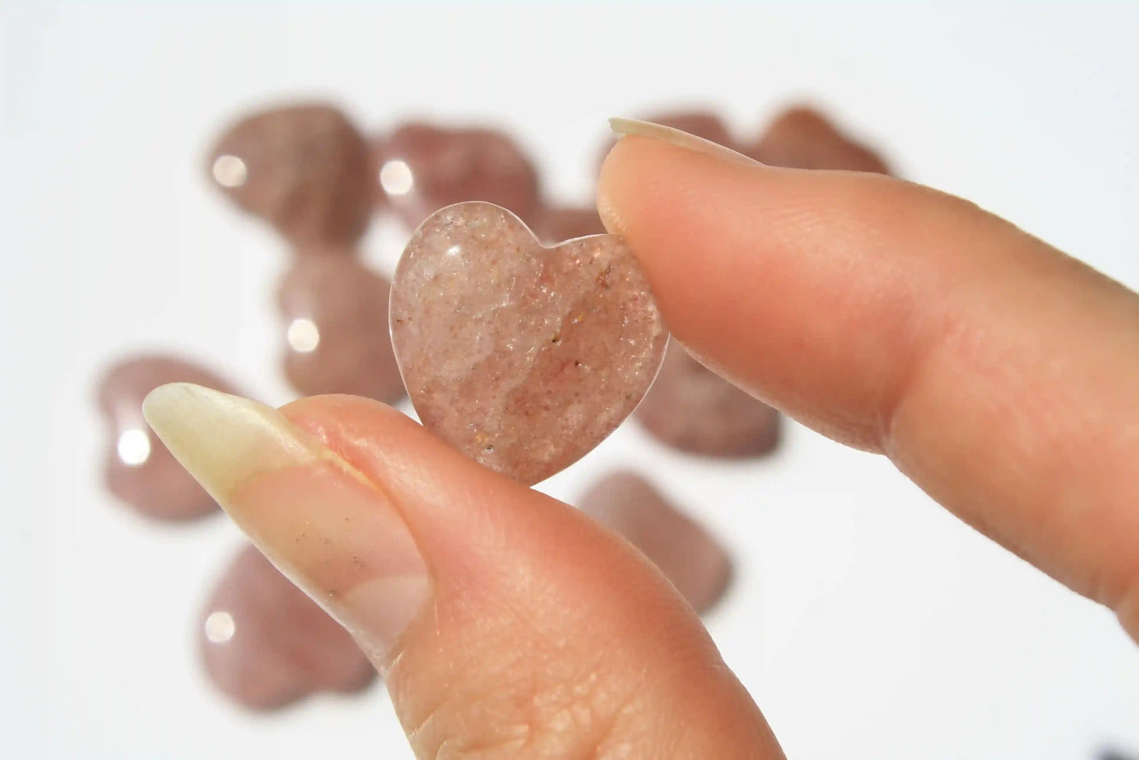 Strawberry quartz heart-shaped crystal with soft pink-red tones symbolizing love, joy, and emotional uplift. quartz heart, Canadian crystal shop