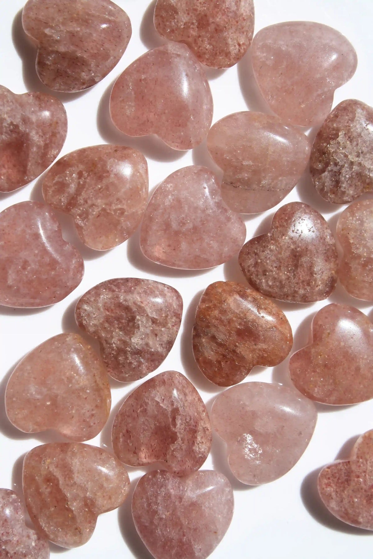 Strawberry quartz heart-shaped crystal with soft pink-red tones symbolizing love, joy, and emotional uplift. quartz heart, Canadian crystal shop