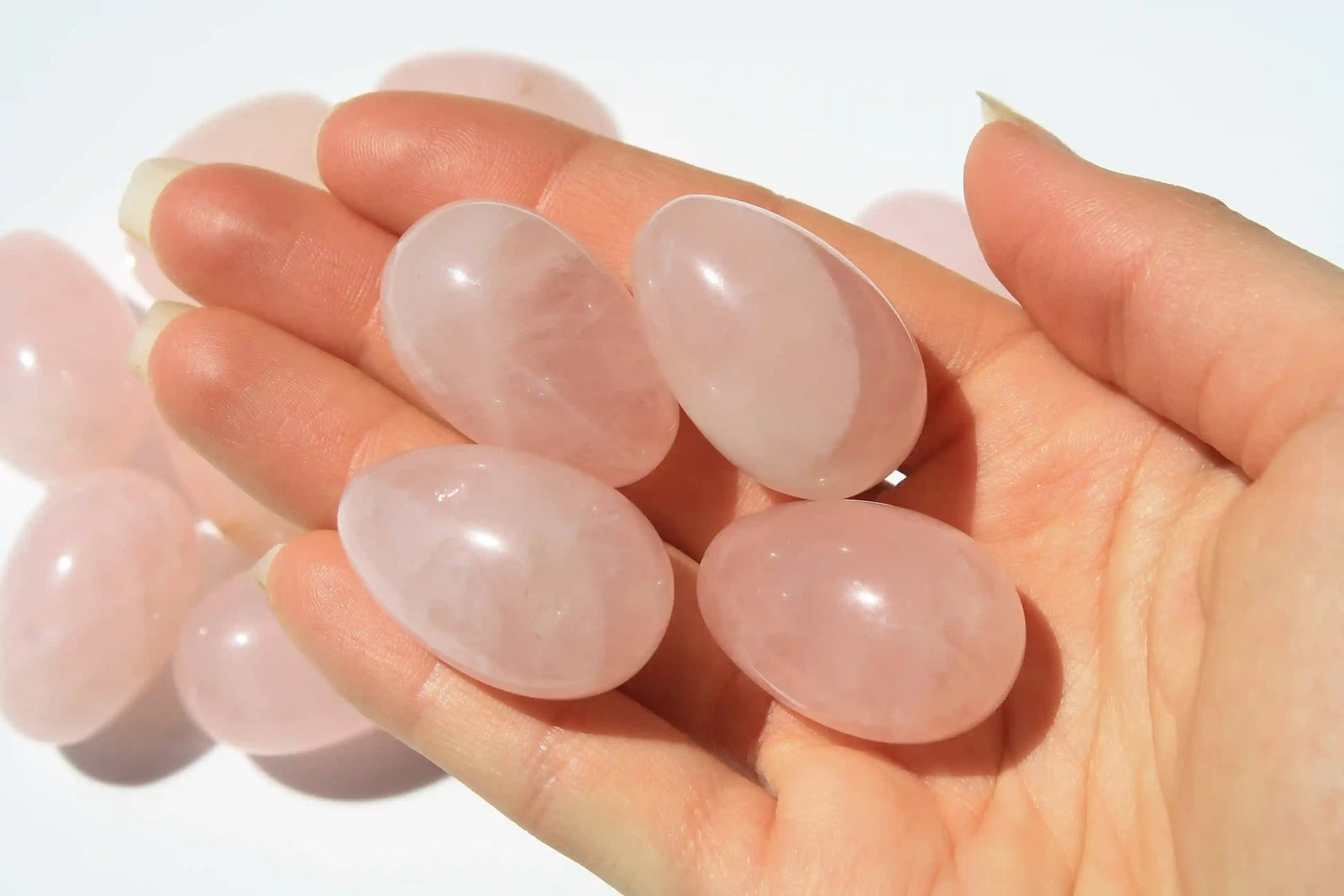 Rose quartz egg-shaped crystal symbolizing love, compassion, rose quartz, quartz crystal, Canadian crystal shop