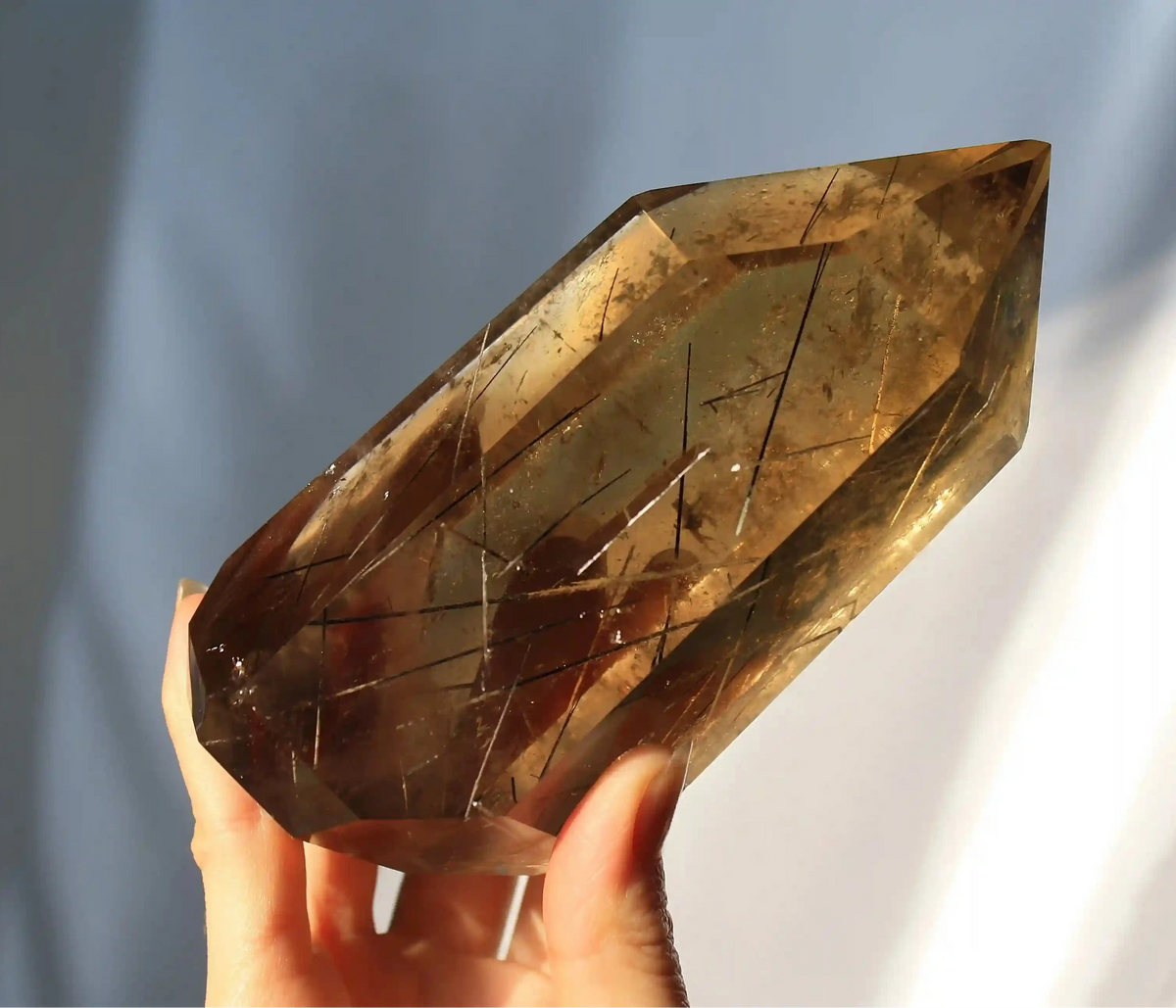 Citrine with golden rutile inclusions, vibrant yellow crystal specimen with radiant needle formations