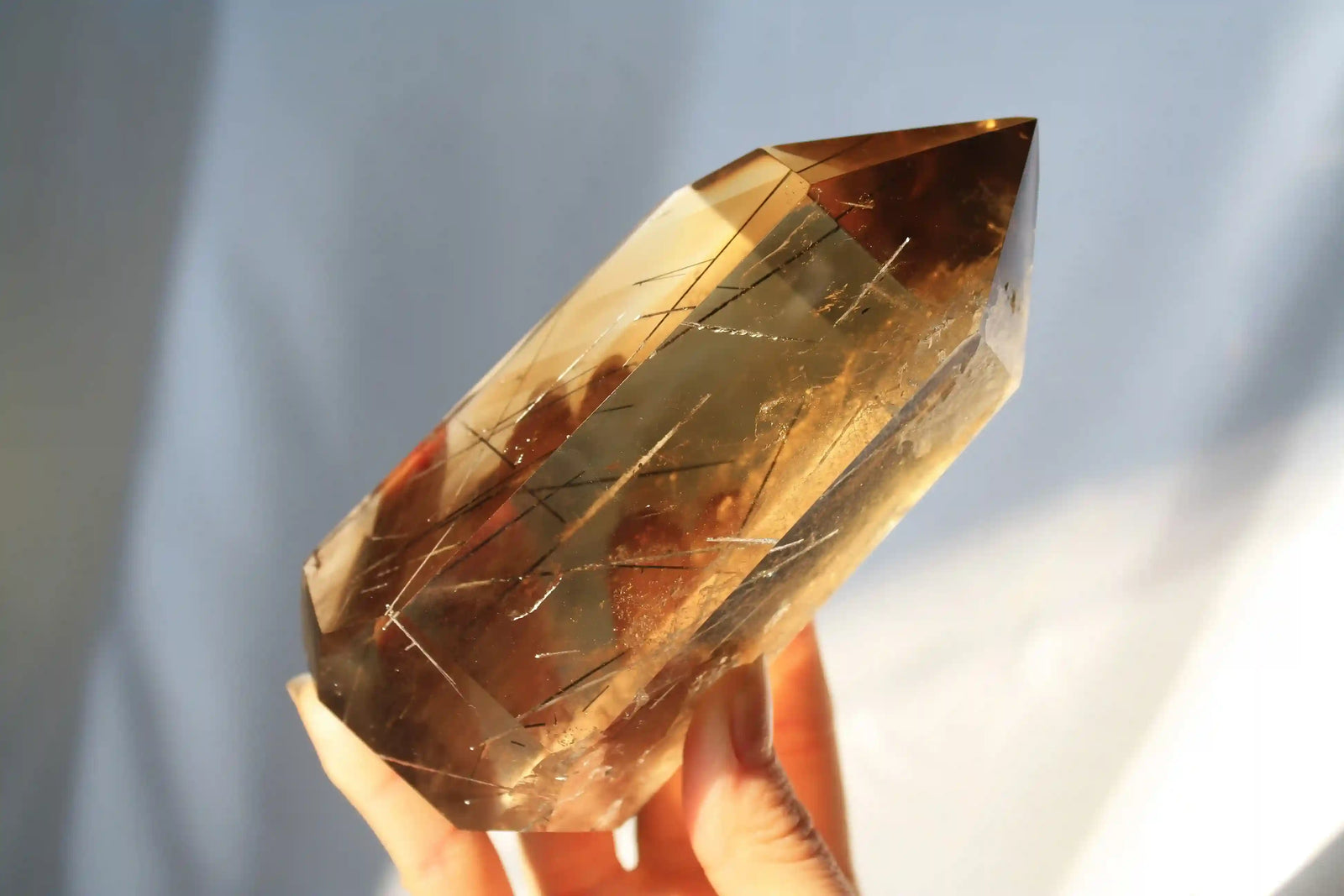 Citrine with golden rutile inclusions, vibrant yellow crystal specimen with radiant needle formations