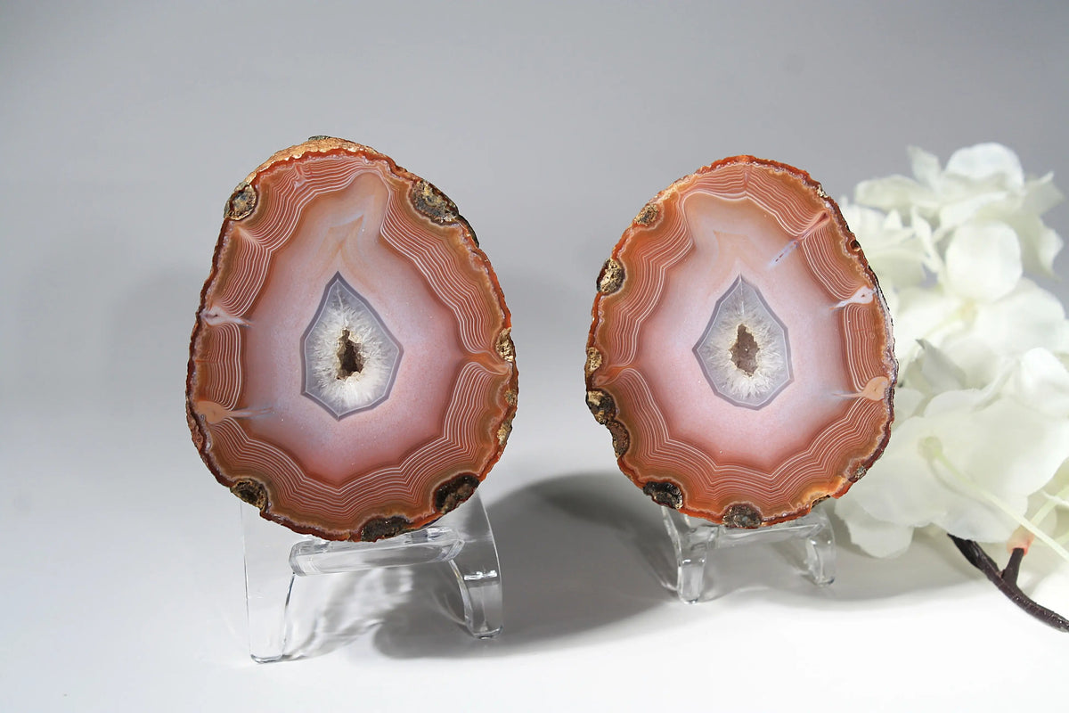 Large pink Zhanguo agate featuring natural banded patterns and a smooth polished finish