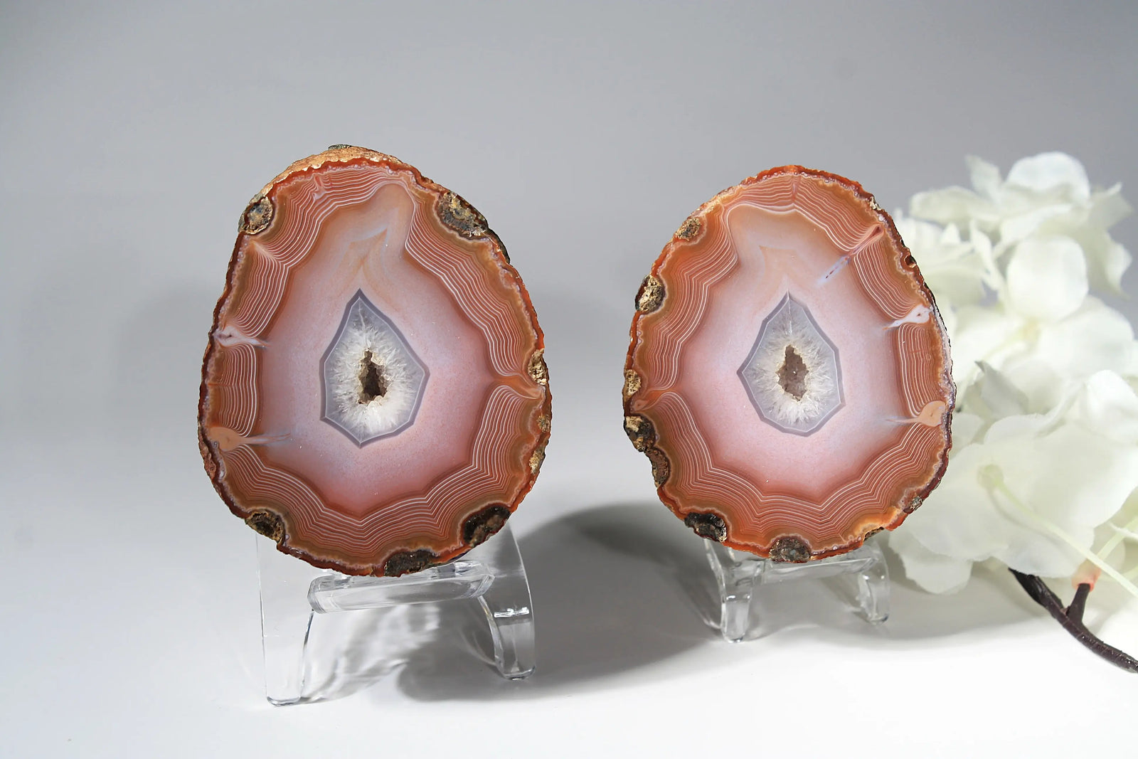 Large pink Zhanguo agate featuring natural banded patterns and a smooth polished finish