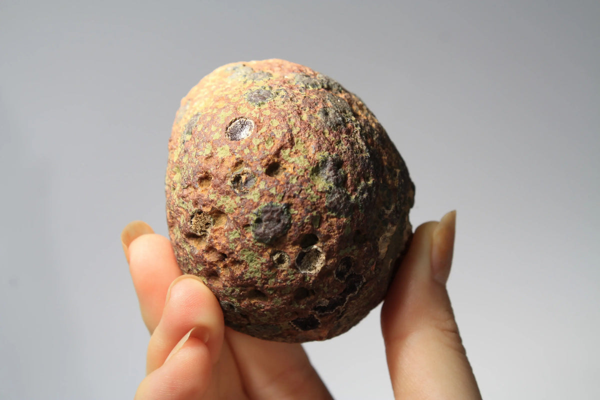 Large pink Zhanguo agate featuring natural banded patterns and a smooth polished finish