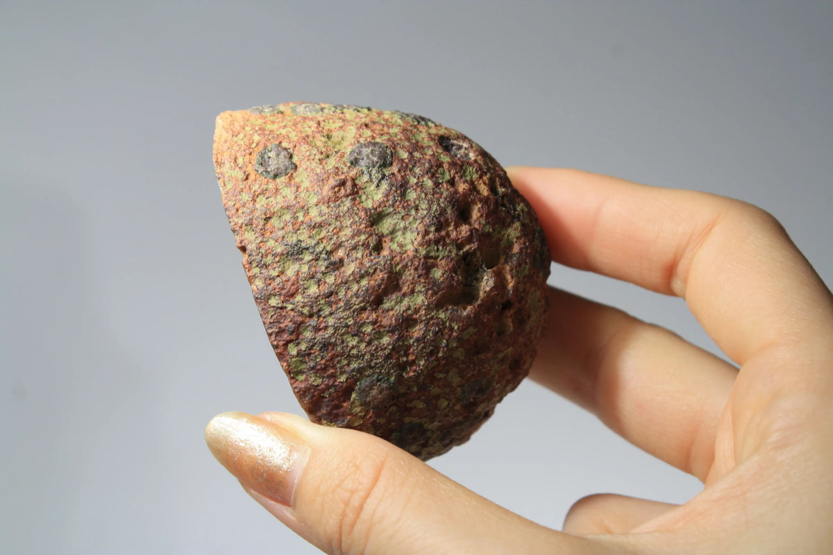Large pink Zhanguo agate featuring natural banded patterns and a smooth polished finish