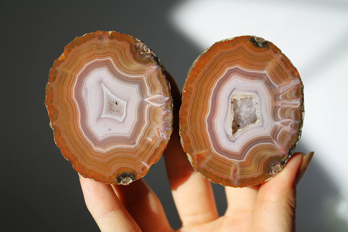 Vibrant Zhanguo agate with bold, swirling bands of crimson, gold, and jade, glowing with depth