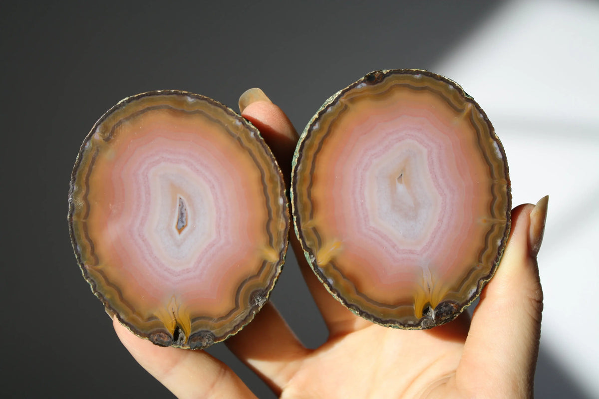 Large banded pink Zhanguo agate pair with soft, flowing layers