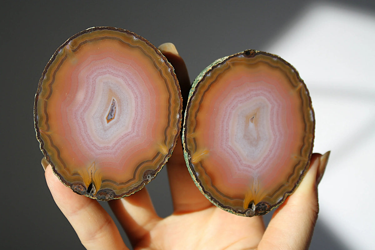 Large banded pink Zhanguo agate pair with soft, flowing layers