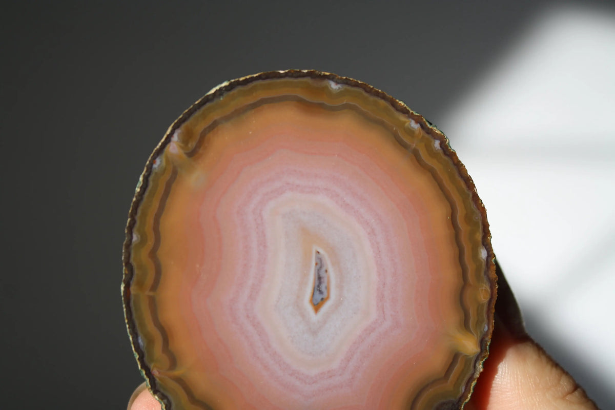 Large banded pink Zhanguo agate pair with soft, flowing layers