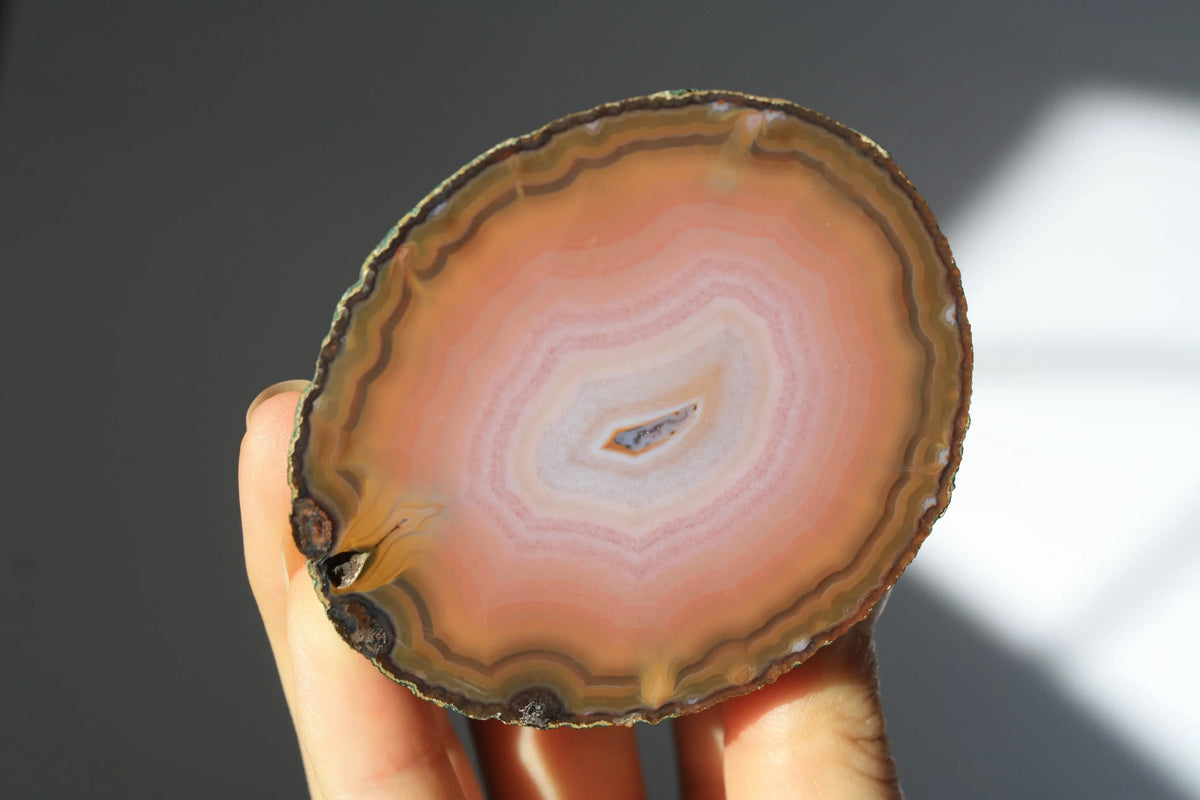 Large banded pink Zhanguo agate pair with soft, flowing layers