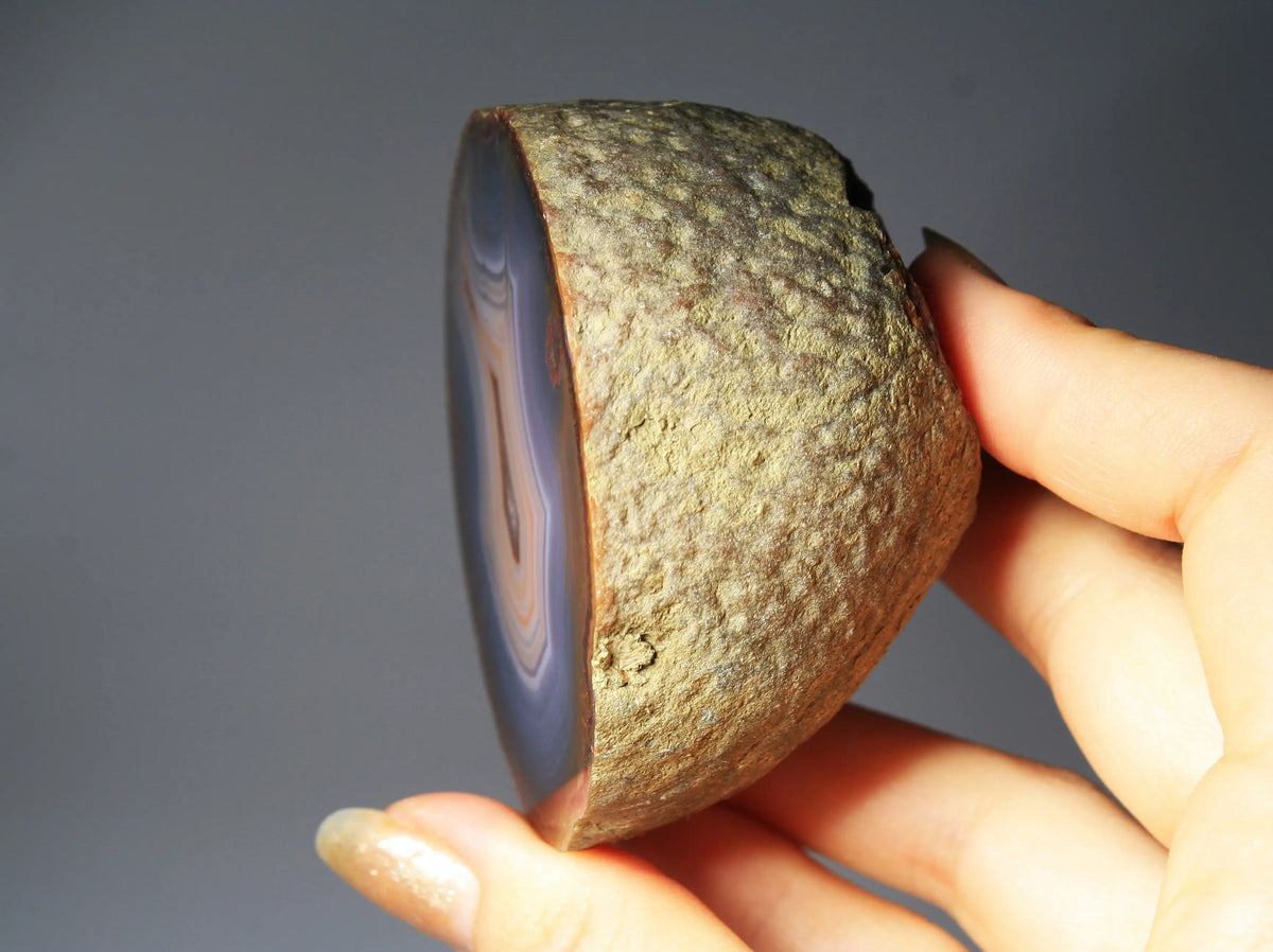 Banded blue Zhanguo agate featuring natural layered patterns and a polished finish