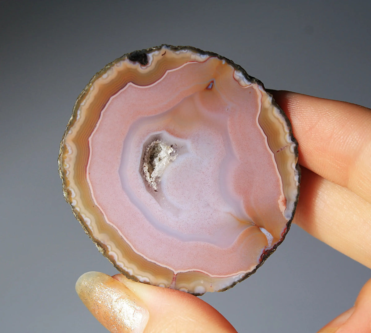 Pink Zhanguo agate pair with delicate, fluid banding