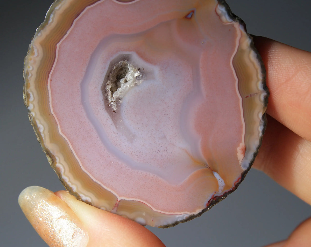 Pink Zhanguo agate pair with delicate, fluid banding