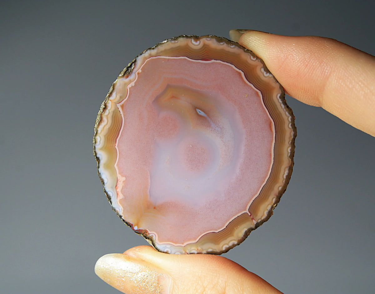 Pink Zhanguo agate pair with delicate, fluid banding