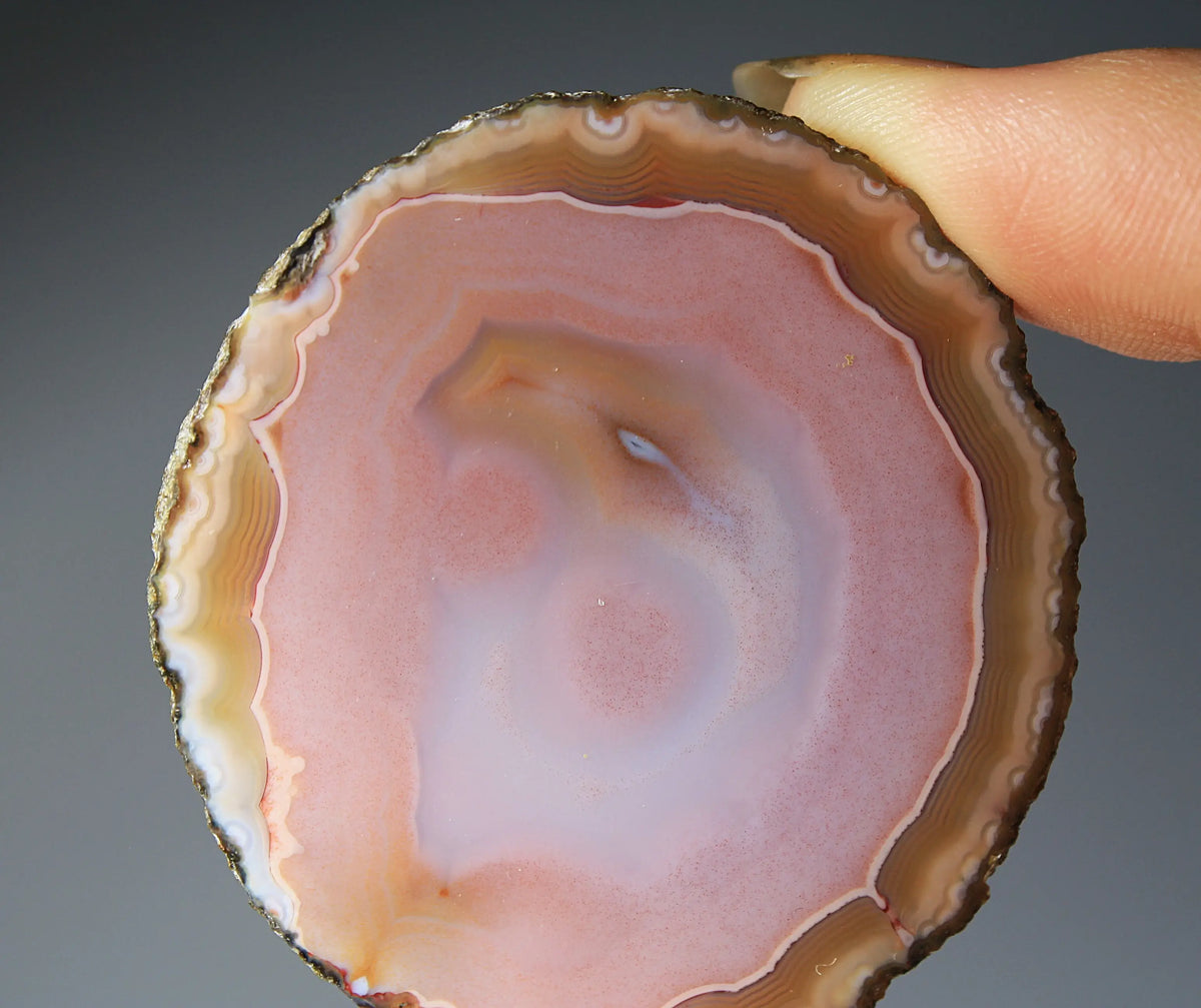 Pink Zhanguo agate pair with delicate, fluid banding