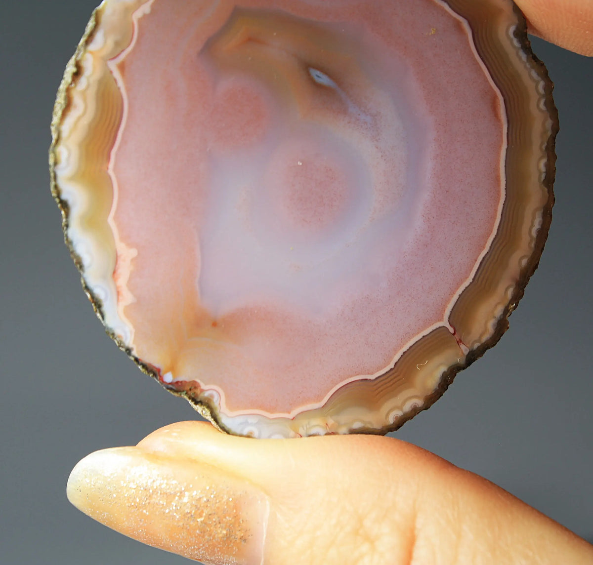 Pink Zhanguo agate pair with delicate, fluid banding