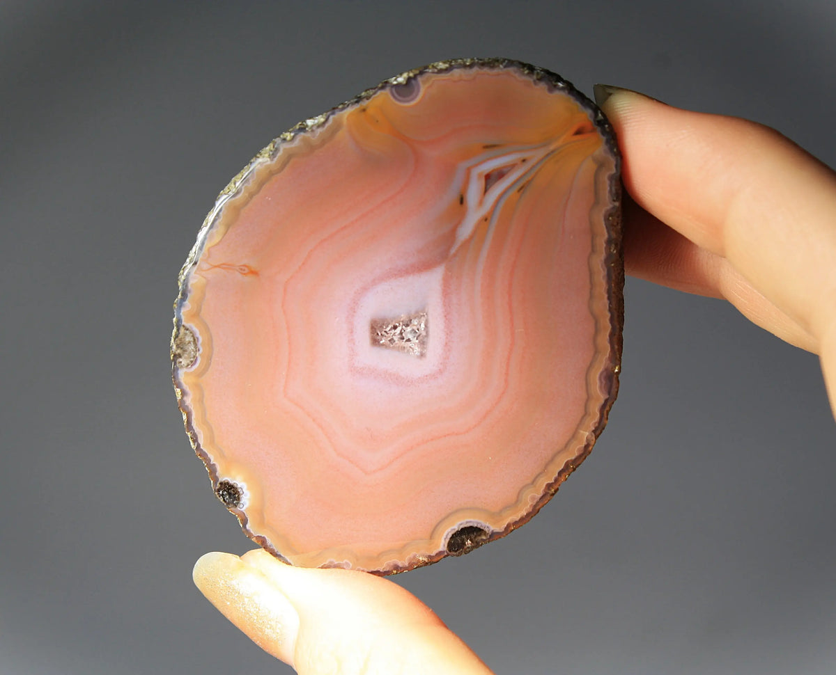 Soft pink banded Zhanguo agate pair glowing with warm, luminous tones