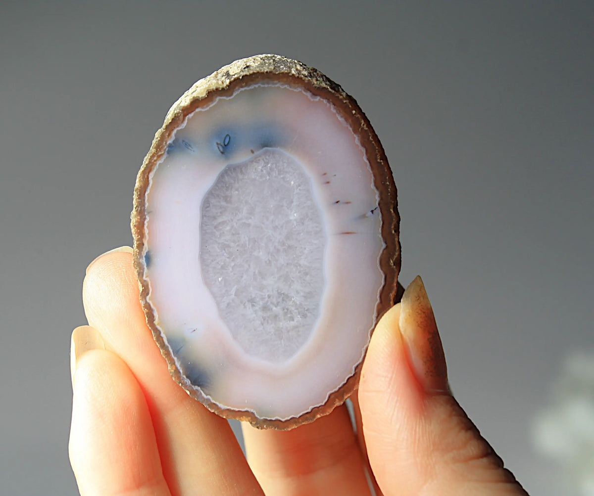 Zhanguo agate pair with striking white and blue features 