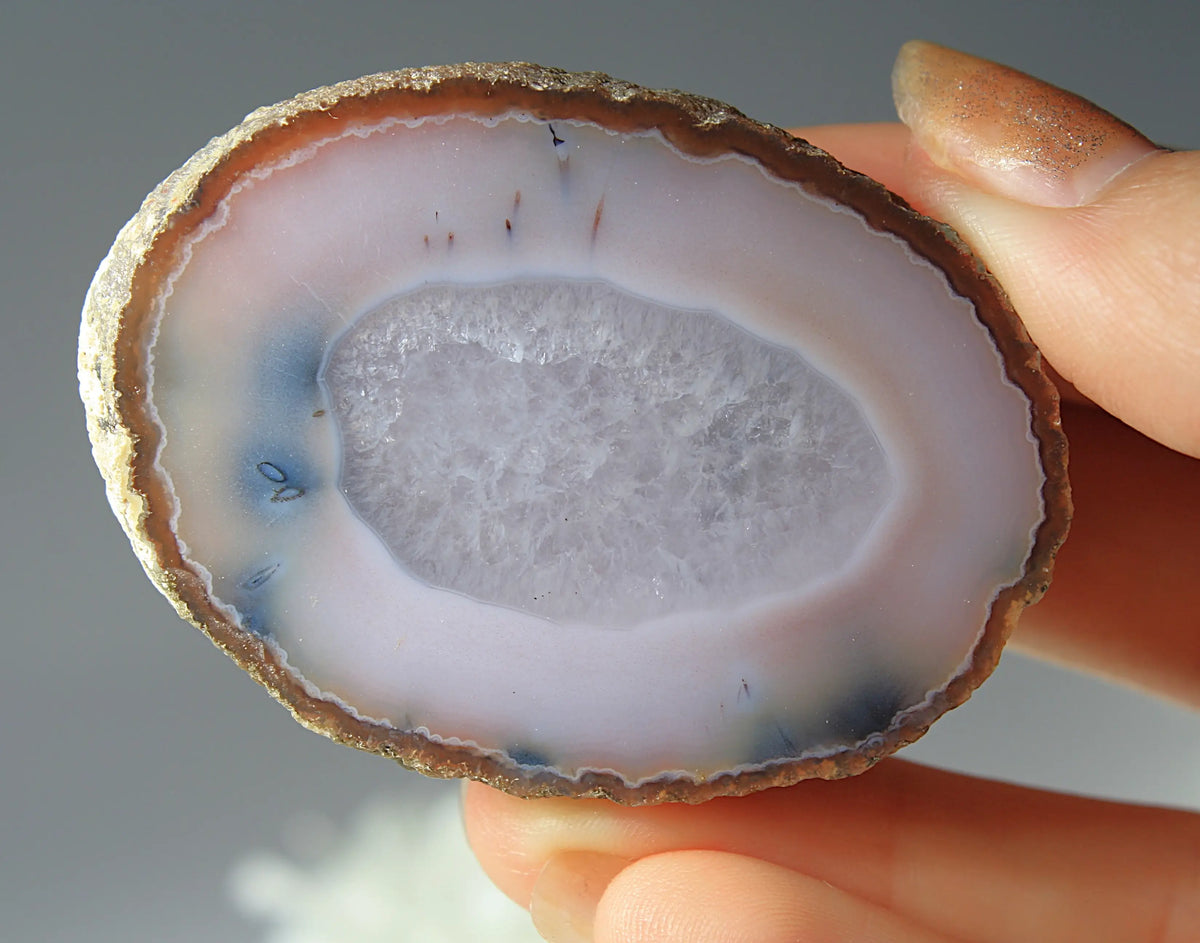 Zhanguo agate pair with striking white and blue features 