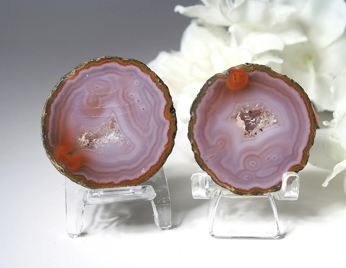 Banded purple Zhanguo agate pair with vivid swirling layers