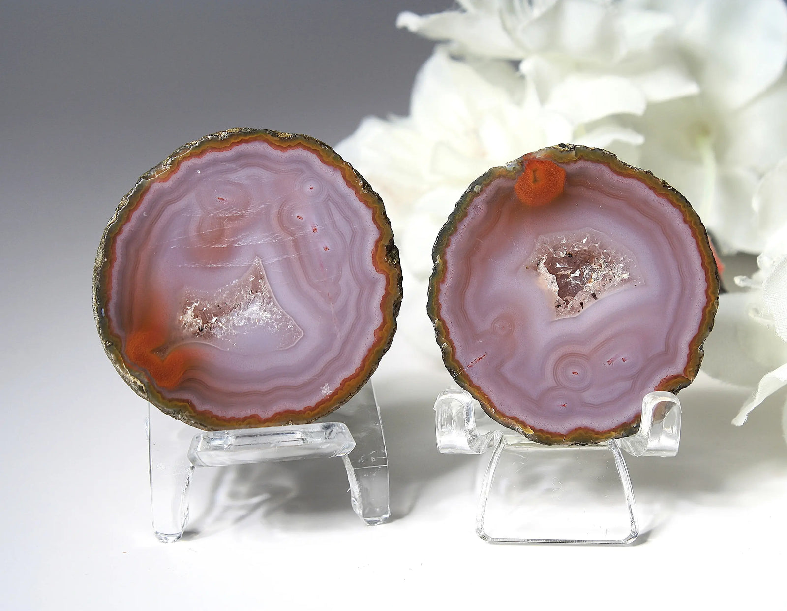 Banded purple Zhanguo agate pair with vivid swirling layers