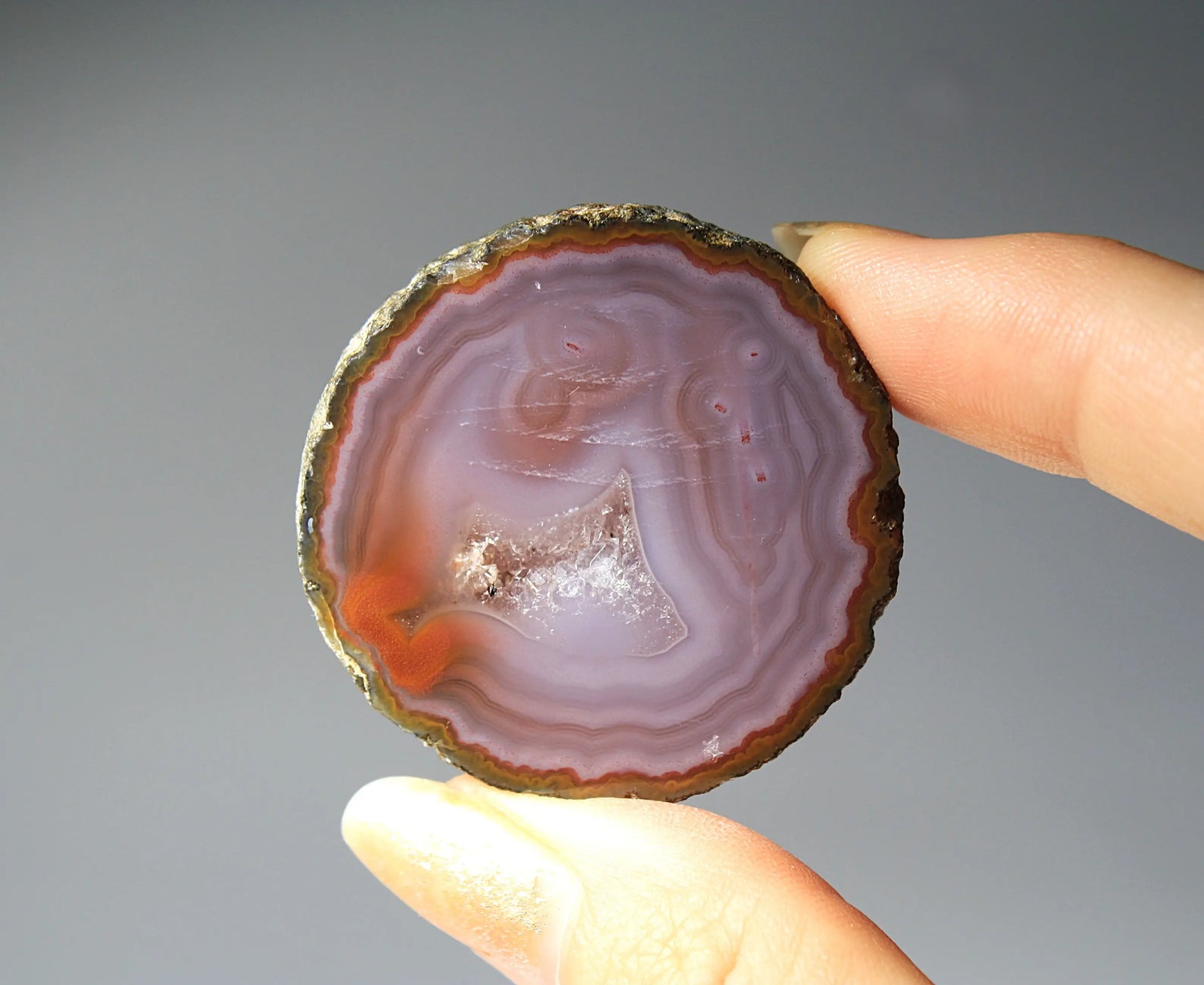 Banded purple Zhanguo agate pair with vivid swirling layers