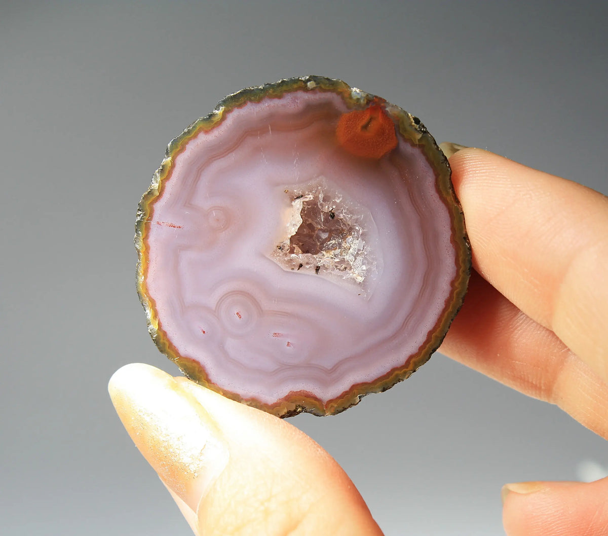 Banded purple Zhanguo agate pair with vivid swirling layers